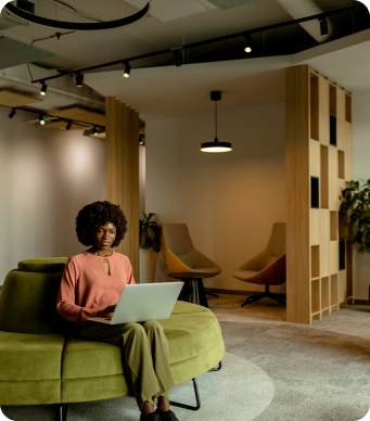 Bronze partner working on a laptop in a modern lounge